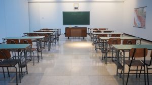 brown wooden table and chairs in a classroom